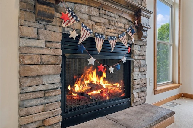 1016 Noble Pine Ct, Trafford, PA 15085 - detailed view of a stone fireplace, baseboards, and carpet