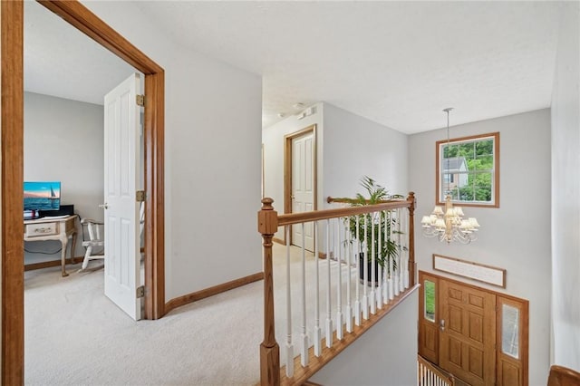 1016 Noble Pine Ct, Trafford, PA 15085 - corridor with an upstairs landing, carpet flooring, a chandelier, baseboards, and a desk