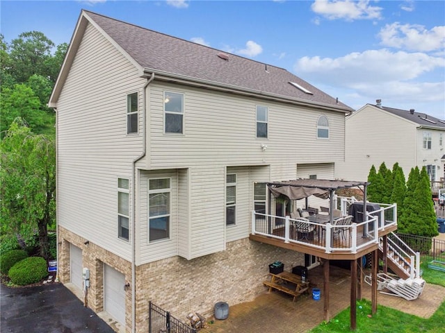 1016 Noble Pine Ct, Trafford, PA 15085 - back of house featuring a wooden deck, an attached garage, a pergola, stairway, and asphalt driveway