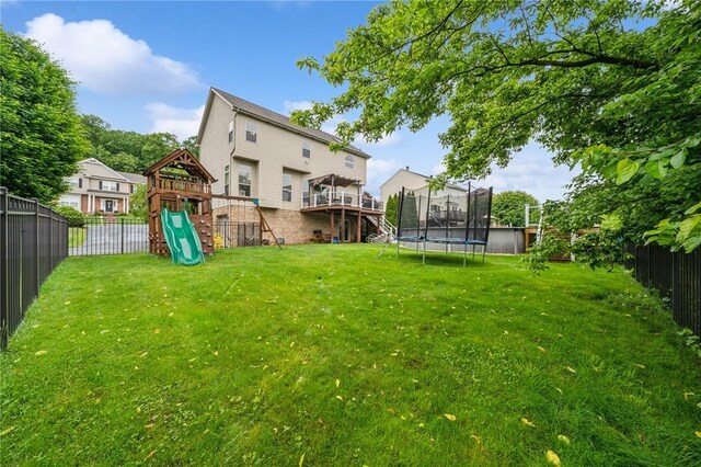 1016 Noble Pine Ct, Trafford, PA 15085 - view of yard featuring a trampoline and a playground
