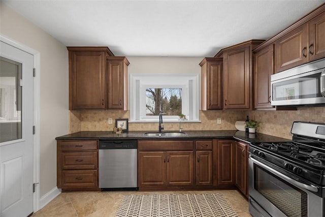 600 Camp Meeting Rd, Leet Twp, PA 15143 - kitchen with appliances with stainless steel finishes, a sink, decorative backsplash, and light tile patterned floors