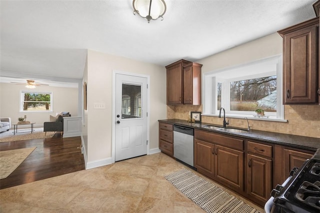 600 Camp Meeting Rd, Leet Twp, PA 15143 - kitchen with stainless steel dishwasher, a sink, dark countertops, and backsplash