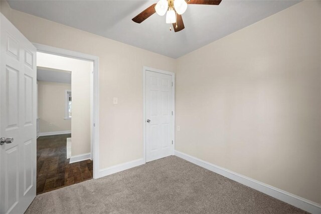 600 Camp Meeting Rd, Leet Twp, PA 15143 - unfurnished bedroom with baseboards, dark colored carpet, and ceiling fan