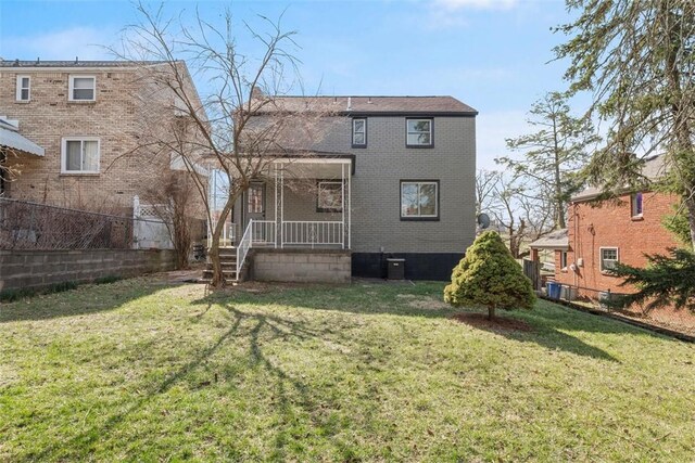 2874 Midland St, Brookline, PA 15226 - rear view of house with covered porch, brick siding, and central AC