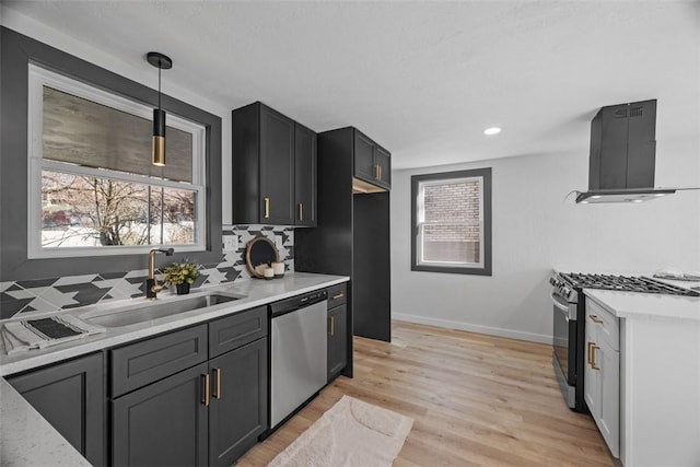 2874 Midland St, Brookline, PA 15226 - kitchen with appliances with stainless steel finishes, a sink, wall chimney range hood, tasteful backsplash, and baseboards