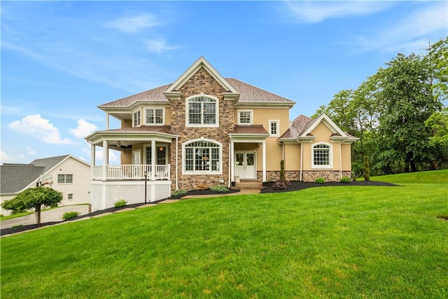 1272 Mcewen Rd, Cecil, PA 15317 - view of front of property featuring a front lawn, stone siding, stucco siding, and a ceiling fan