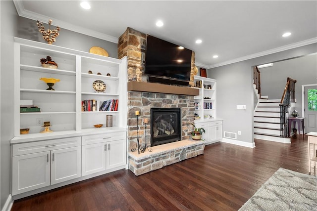 1272 Mcewen Rd, Cecil, PA 15317 - living room featuring crown molding, dark wood-style flooring, a fireplace, stairway, and baseboards