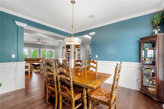 1272 Mcewen Rd, Cecil, PA 15317 - dining space featuring ornate columns, crown molding, dark wood finished floors, a wainscoted wall, and a ceiling fan