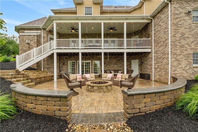 1272 Mcewen Rd, Cecil, PA 15317 - rear view of property with an outdoor living space with a fire pit, a ceiling fan, a patio, stairs, and brick siding