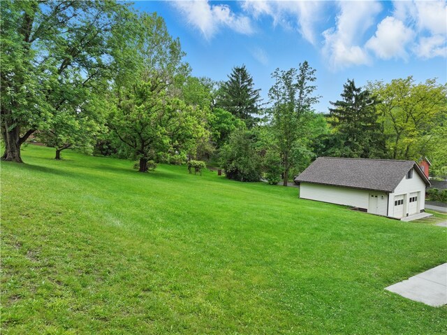 406 Maple Dr, Irwin, PA 15617 - view of green lawn with a garage and an outbuilding