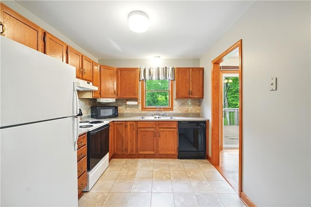 406 Maple Dr, Irwin, PA 15617 - kitchen featuring black appliances, under cabinet range hood, a sink, backsplash, and light countertops