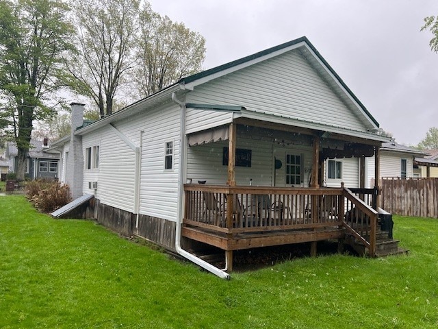 11863 Lakeview, Conneaut Lake Cra, PA 16316 - rear view of property with a chimney and a wooden deck