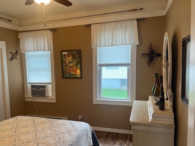 11863 Lakeview, Conneaut Lake Cra, PA 16316 - bedroom featuring wood finished floors, cooling unit, a baseboard heating unit, baseboards, and a ceiling fan