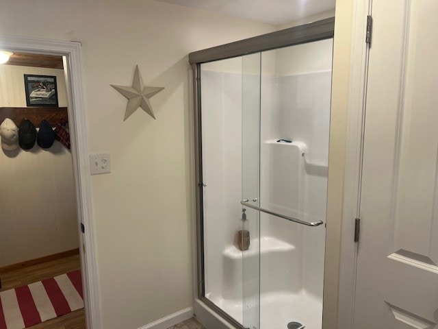 11863 Lakeview, Conneaut Lake Cra, PA 16316 - full bathroom featuring a stall shower, baseboards, and wood finished floors