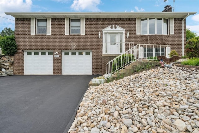 1967 Rostraver, Rostraver, PA 15012 - split foyer home featuring asphalt driveway, a garage, and brick siding