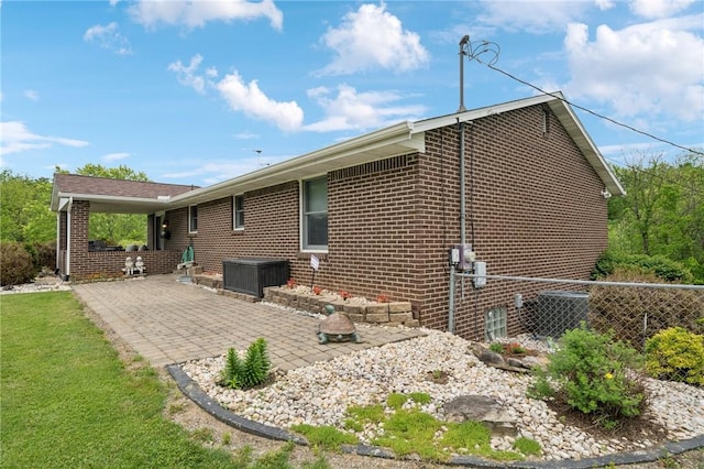 1967 Rostraver, Rostraver, PA 15012 - rear view of house featuring brick siding and a patio area