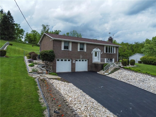 1967 Rostraver, Rostraver, PA 15012 - raised ranch featuring brick siding, driveway, a chimney, a garage, and a front lawn