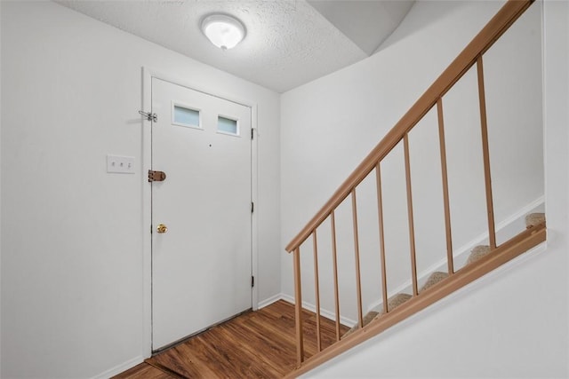303 Laporte Ct, Cranberry Twp, PA 16066 - foyer with a textured ceiling, wood finished floors, stairway, and baseboards