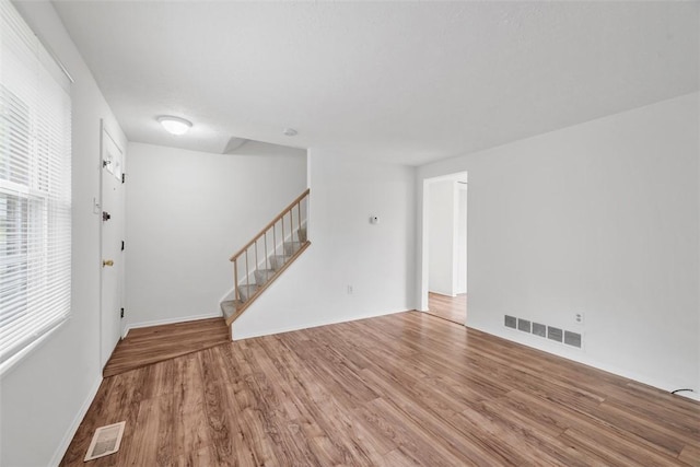 303 Laporte Ct, Cranberry Twp, PA 16066 - empty room featuring stairway, wood finished floors, and baseboards