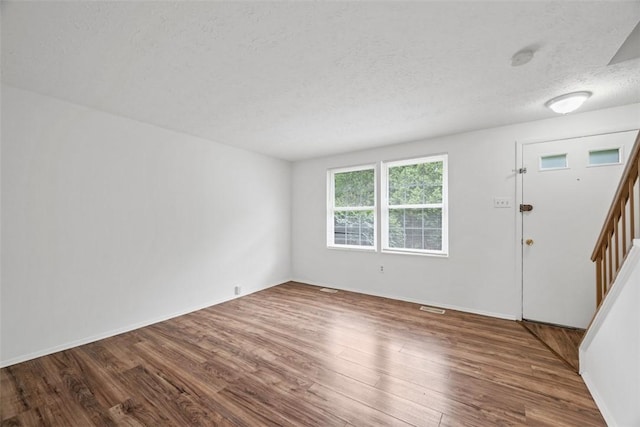 303 Laporte Ct, Cranberry Twp, PA 16066 - entrance foyer featuring wood finished floors, stairs, a textured ceiling, and baseboards