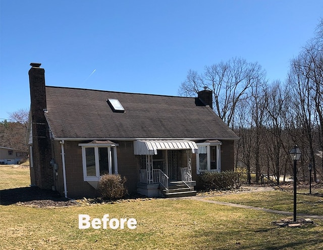 102 Green Vista Dr, Ohio Twp, PA 15237 - view of front of property with a chimney, a front yard, concrete block siding, and a shingled roof
