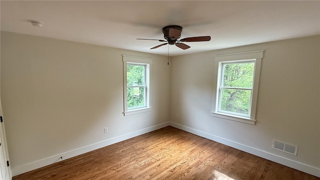 102 Green Vista Dr, Ohio Twp, PA 15237 - empty room with plenty of natural light, a ceiling fan, and light wood-style flooring