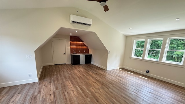 102 Green Vista Dr, Ohio Twp, PA 15237 - bonus room with a wall unit AC, lofted ceiling, ceiling fan, and wood finished floors