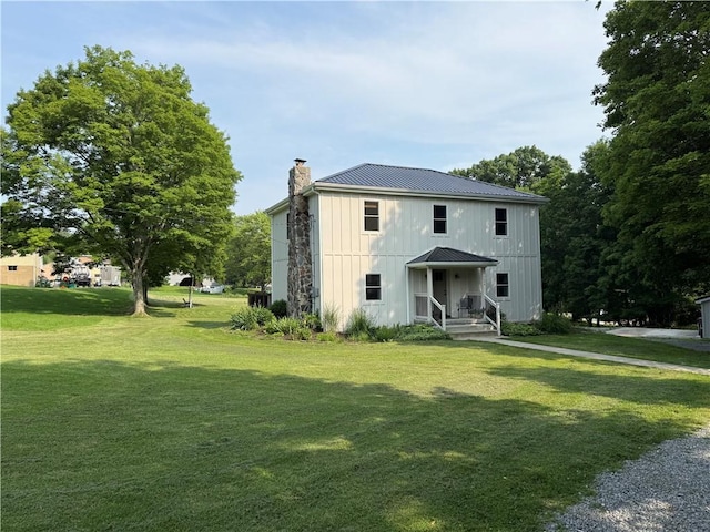102 Green Vista Dr, Ohio Twp, PA 15237 - view of front of property featuring a chimney, a metal roof, a front yard, and a standing seam roof