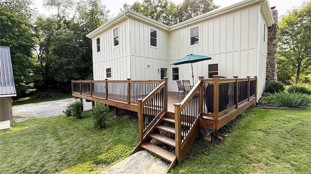 102 Green Vista Dr, Ohio Twp, PA 15237 - back of property with board and batten siding, a lawn, and a deck