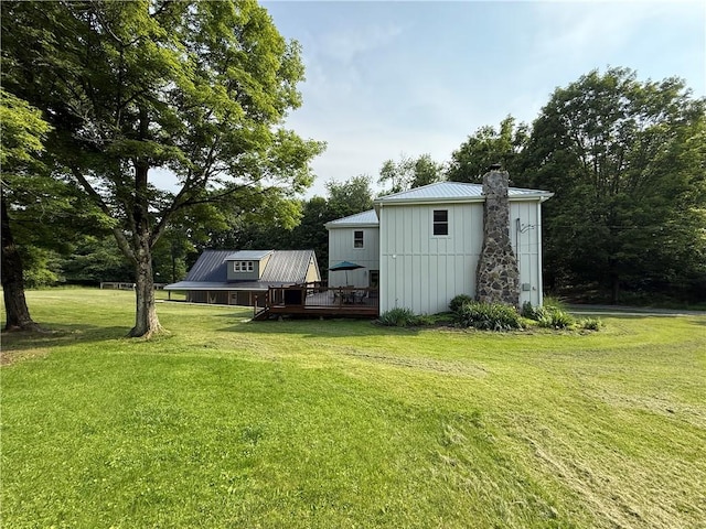 102 Green Vista Dr, Ohio Twp, PA 15237 - view of green lawn featuring a deck, an outbuilding, and view of wooded area