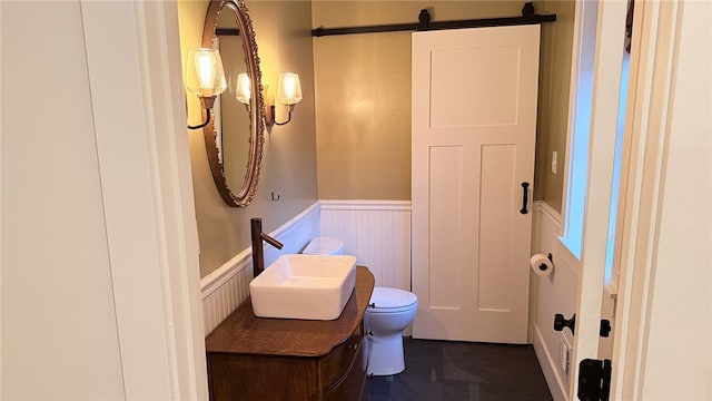 102 Green Vista Dr, Ohio Twp, PA 15237 - bathroom with wainscoting, a decorative wall, and vanity