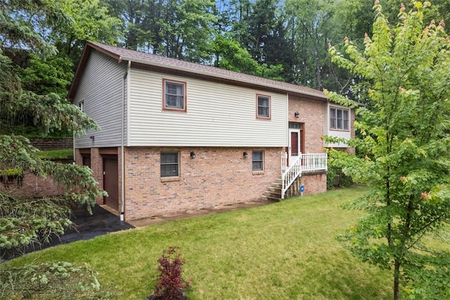 803 E Arcadia Dr, Mccandless, PA 15237 - back of property with brick siding and a yard