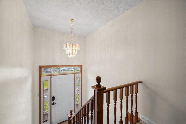803 E Arcadia Dr, Mccandless, PA 15237 - entryway featuring a chandelier and baseboards