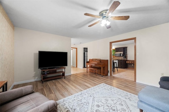 803 E Arcadia Dr, Mccandless, PA 15237 - living area with wood finished floors, ceiling fan, and baseboards