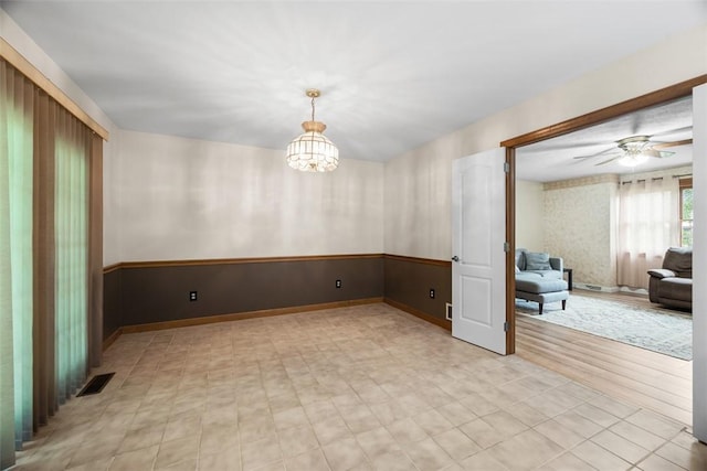 803 E Arcadia Dr, Mccandless, PA 15237 - spare room with a chandelier, ceiling fan, baseboards, and wallpapered walls