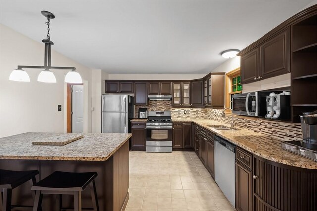 803 E Arcadia Dr, Mccandless, PA 15237 - kitchen with appliances with stainless steel finishes, a sink, under cabinet range hood, open shelves, and tasteful backsplash