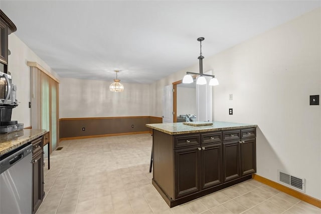 803 E Arcadia Dr, Mccandless, PA 15237 - kitchen with stainless steel dishwasher, pendant lighting, light stone countertops, baseboards, and dark brown cabinetry