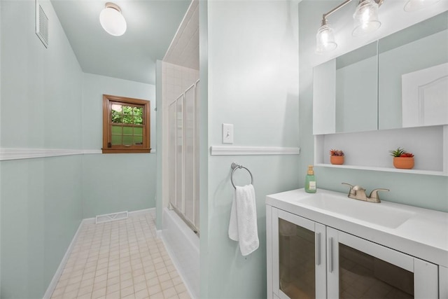 803 E Arcadia Dr, Mccandless, PA 15237 - bathroom with vanity, baseboards, tile patterned floors, and bath / shower combo with glass door