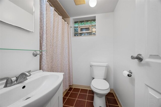 803 E Arcadia Dr, Mccandless, PA 15237 - bathroom featuring a sink, toilet, tile patterned flooring, and baseboards