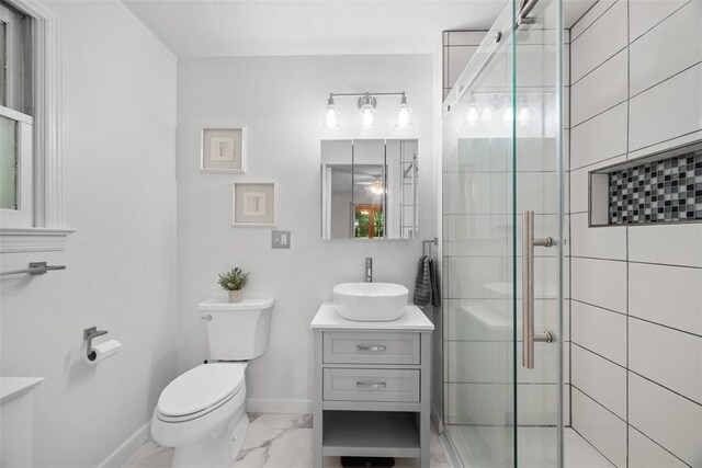 803 E Arcadia Dr, Mccandless, PA 15237 - bathroom featuring marble finish floors, toilet, a stall shower, vanity, and baseboards