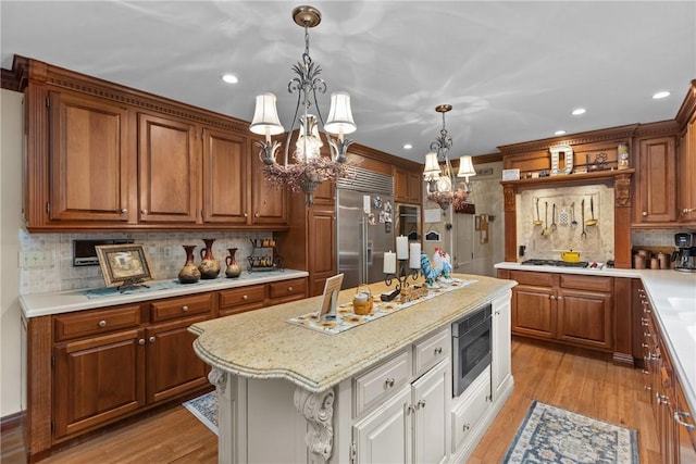 138 Presnar Dr, Neshannock Twp, PA 16105 - kitchen featuring built in appliances, a chandelier, tasteful backsplash, brown cabinets, and recessed lighting