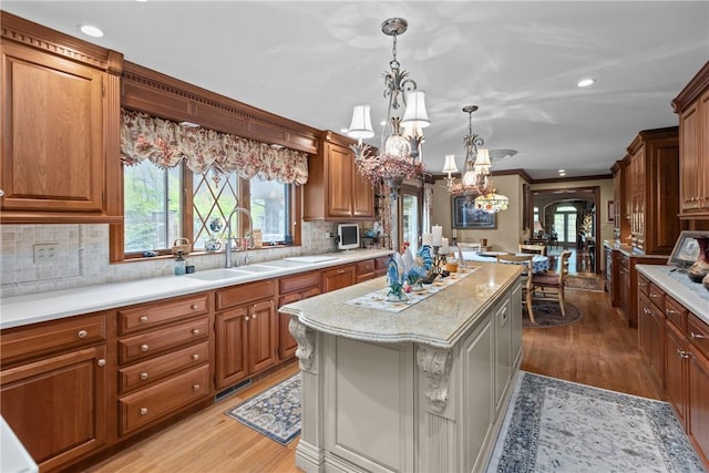 138 Presnar Dr, Neshannock Twp, PA 16105 - kitchen featuring a chandelier, light wood-style floors, a kitchen island, a sink, and recessed lighting