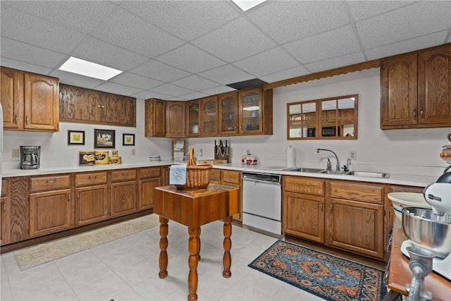 138 Presnar Dr, Neshannock Twp, PA 16105 - kitchen with dishwasher, a sink, brown cabinetry, a paneled ceiling, and light countertops