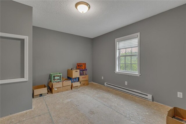 677 Fairlane Blvd, New Galilee, PA 16141 - unfurnished room with a baseboard radiator and a textured ceiling
