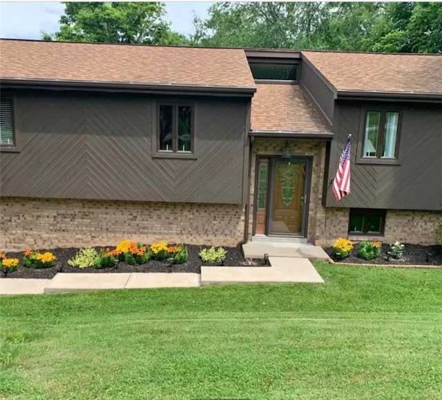 685 Deerfield Rd, South Franklin, PA 15301 - view of front of property with brick siding, a front lawn, and roof with shingles