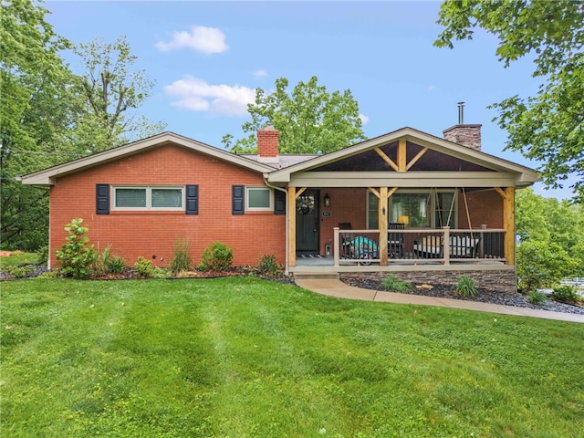857 E Mcmurray Rd, Peters Twp, PA 15367 - ranch-style house with a chimney, brick siding, and a front lawn