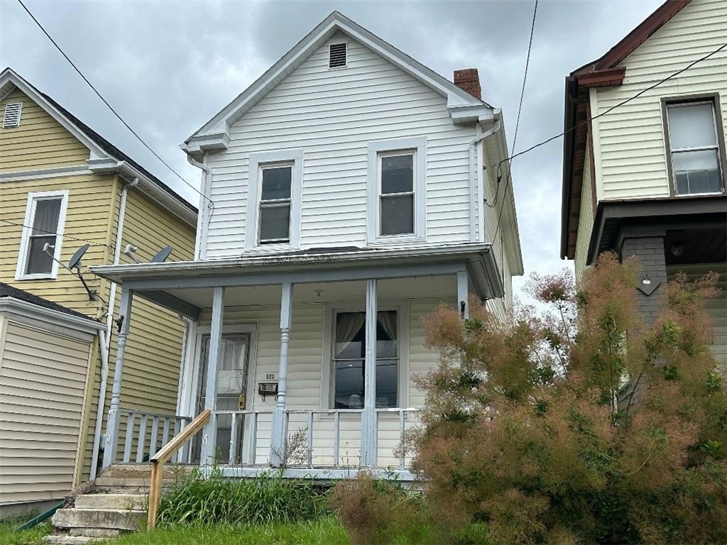 523 Franklin Ave, Canonsburg, PA 15317 - view of front facade featuring covered porch and a chimney
