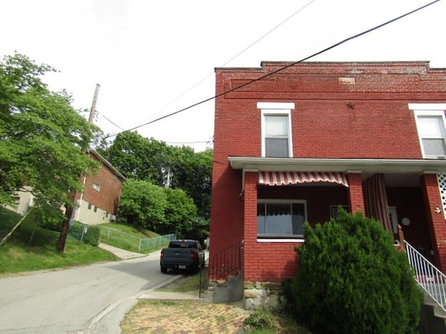1214 1/2 3rd St, Mckees Rocks, PA 15136 - view of property exterior featuring brick siding