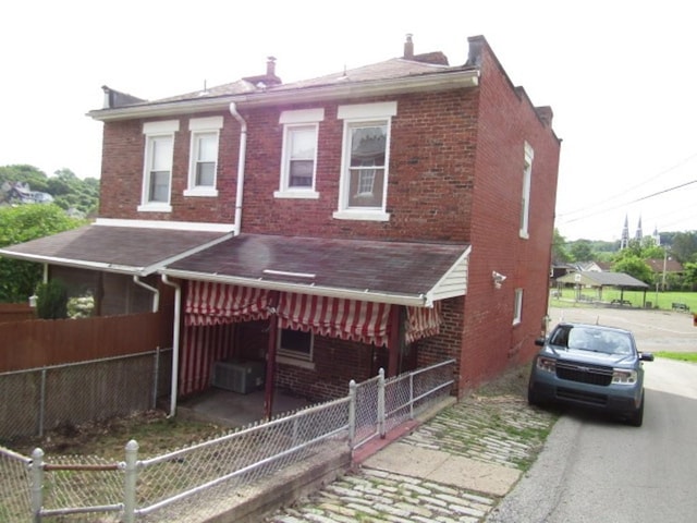 1214 1/2 3rd St, Mckees Rocks, PA 15136 - townhome / multi-family property featuring brick siding and a shingled roof