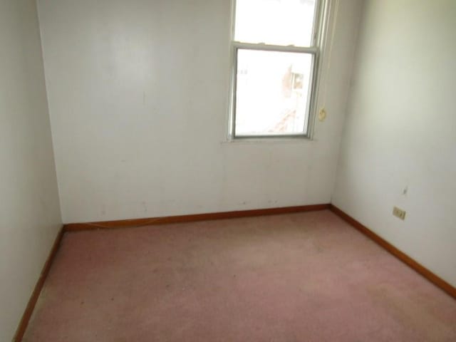 1214 1/2 3rd St, Mckees Rocks, PA 15136 - spare room featuring light colored carpet and baseboards